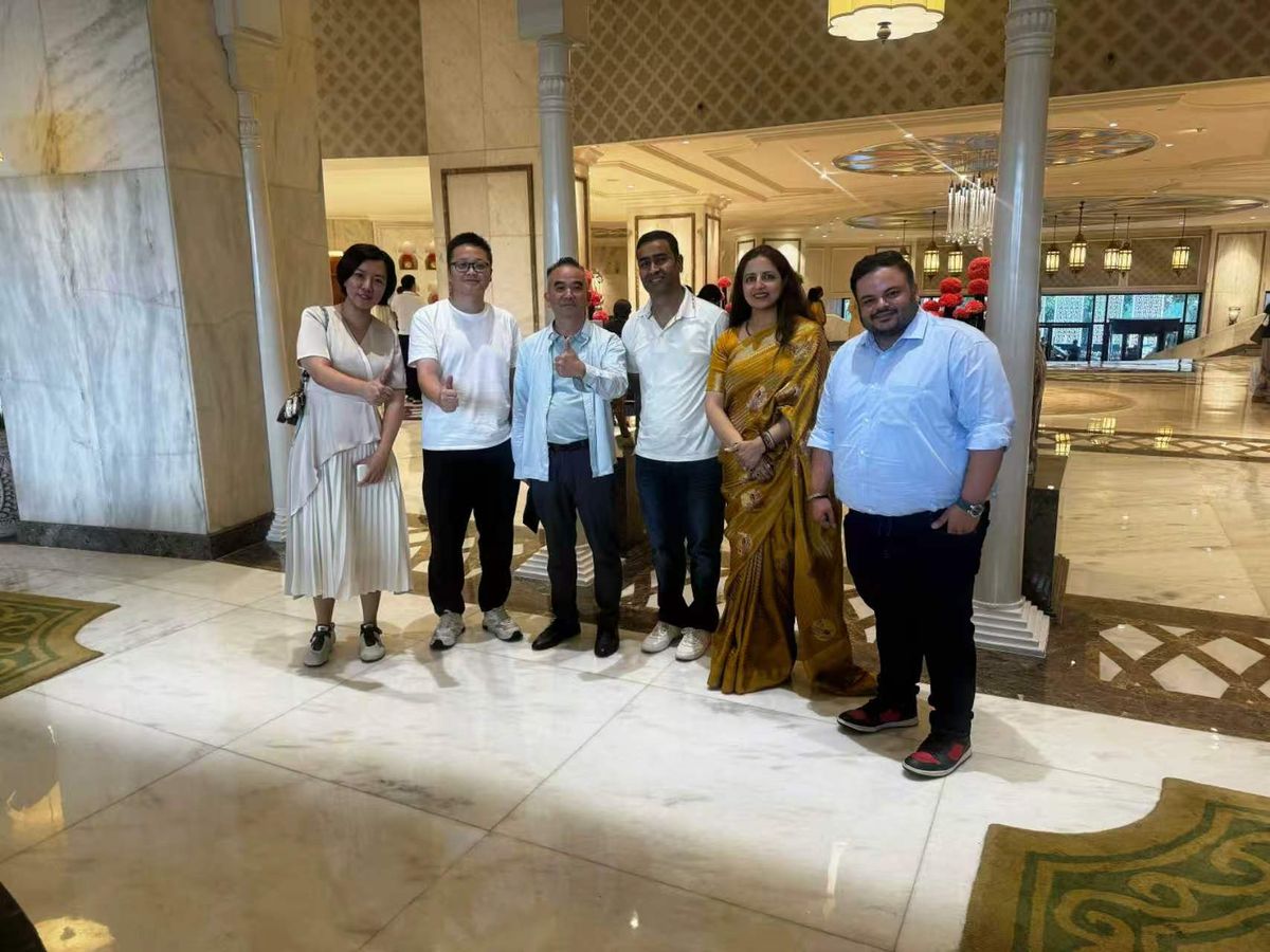 Group photo with buyers in a hotel lobby